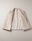 Silvorne beige polyester casual jacket with French collar and double-breasted closure.