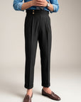 Silvorne Men's black high-waist straight-leg draped trousers with double button detail and cuffed hem.