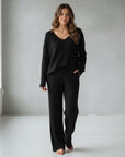 Silvorne black ribbed knit V-neck loungewear set with wide leg pants.