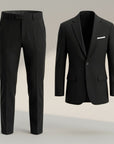 Silvorne black woven two piece suit set with tailored jacket and straight-leg trousers. Jacket features lapel collar and button closure.