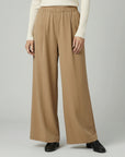 Silvorne women's camel wide-leg trousers with elastic waistband and pleated detail, full length.