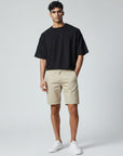 Silvorne men's relaxed fit chino shorts in beige cotton with elastic waist detail and cuffed hems.