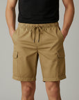 Silvorne men's khaki cargo shorts with drawstring waist, side pockets, and cuffed hems. Model is wearing a black t-shirt.