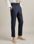 Silvorne Men's dark navy high-waist tailored trousers in woven fabric with pleats and a classic waistband.