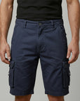Silvorne men's navy blue cotton cargo shorts with elasticated waist, button fastening, and flap pockets.