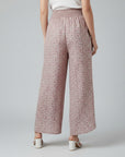 Silvorne women's wide-leg trousers in pink with a ditsy floral print and elastic waistband.