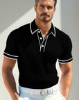Silvorne polo de manga corta negro con ribetes blancos, tejido acanalado, cuello y puños a rayas. Ideal para verano.