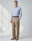 Silvorne men's high-waist tan woven trousers with straight-leg drape and double pleats.