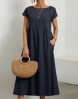 Silvorne Vestido maxi de lino y algodón azul marino de manga corta con bolsillos y cuello redondo.
