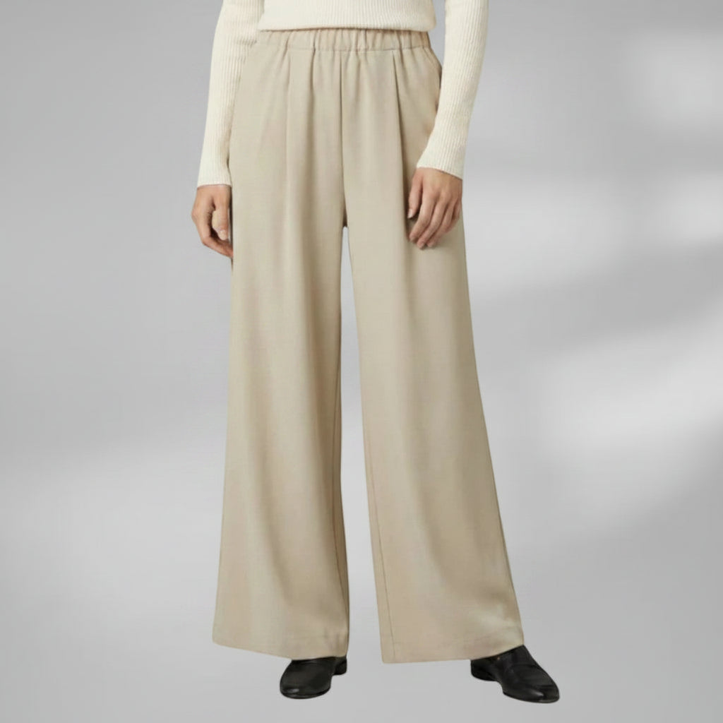 Silvorne women's beige wide-leg trousers with elastic waistband and pleated detail, casual wear.