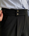 Silvorne men's black high-waist straight-leg draped trousers with double button closure and side pocket detail.