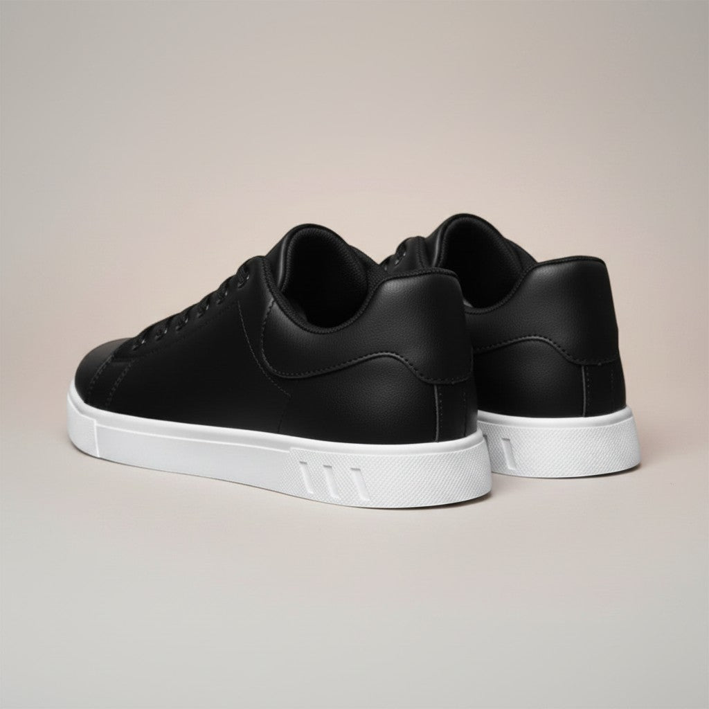 Silvorne black faux leather low top trainers with white soles. Men's casual sneakers with a minimalist design.