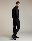 Silvorne men's black high-waist tailored trousers made from premium woven fabric. Model wears trousers with a black shirt and loafers.