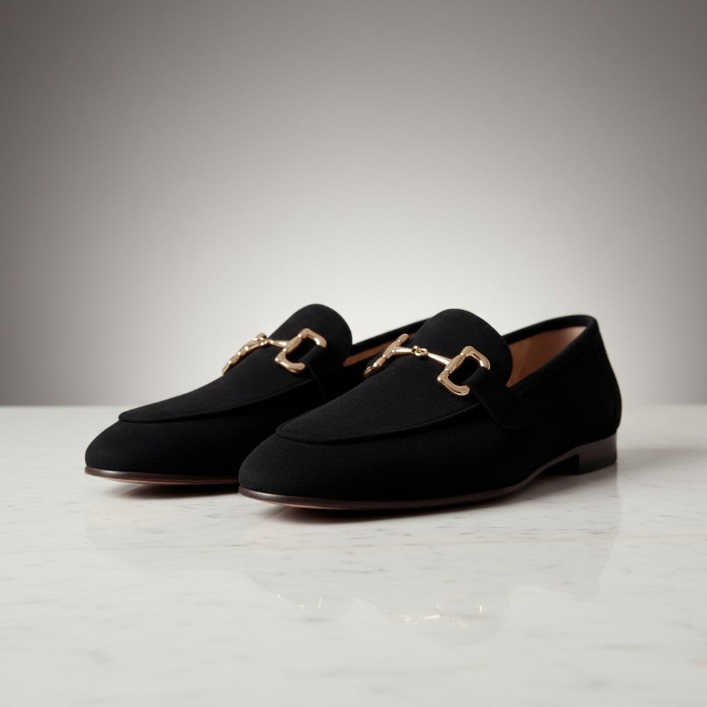 Silvorne black suede loafers with gold horsebit detail and almond toe. Suitable for casual or semi-formal wear.