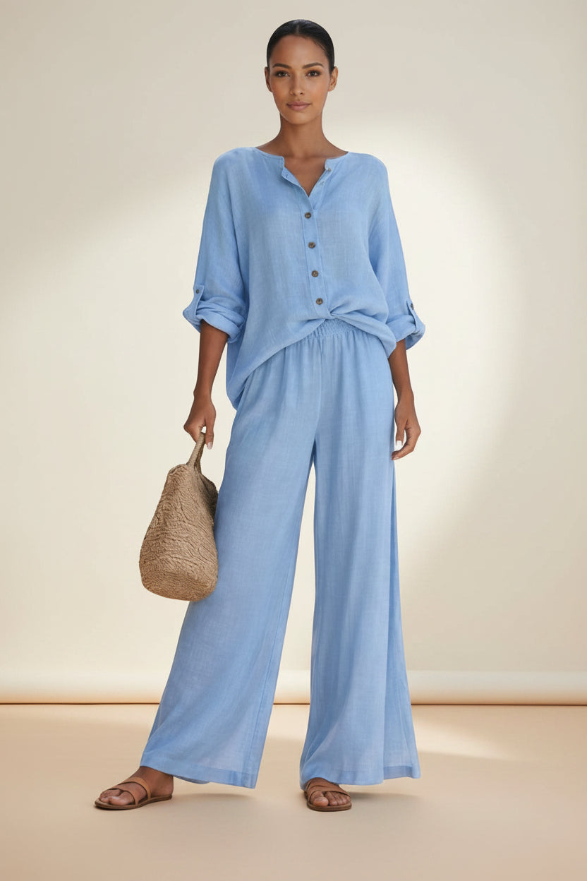 Silvorne light blue linen blend button front blouse and wide leg trousers set on a woman.