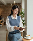 Silvorne blusa de poliéster azul y blanco de manga larga con cuello polo, estilo falso de dos piezas.