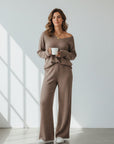 Silvorne brown ribbed knit V-neck loungewear set with wide leg pants, worn by a woman holding a mug.