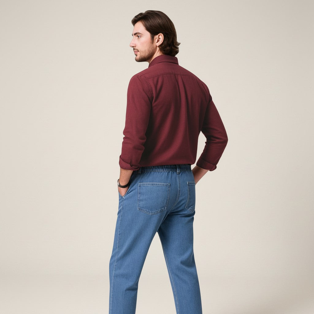 Silvorne men's solid burgundy long-sleeve button-up shirt with a turn-down collar, paired with light wash denim jeans.