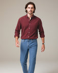 Silvorne men's slim-fit burgundy long-sleeve button-up shirt with turn-down collar and chest pocket, paired with blue jeans.