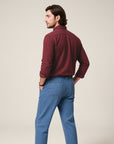 Silvorne men's solid burgundy long-sleeve button-up shirt with a turn-down collar, paired with light wash denim jeans.