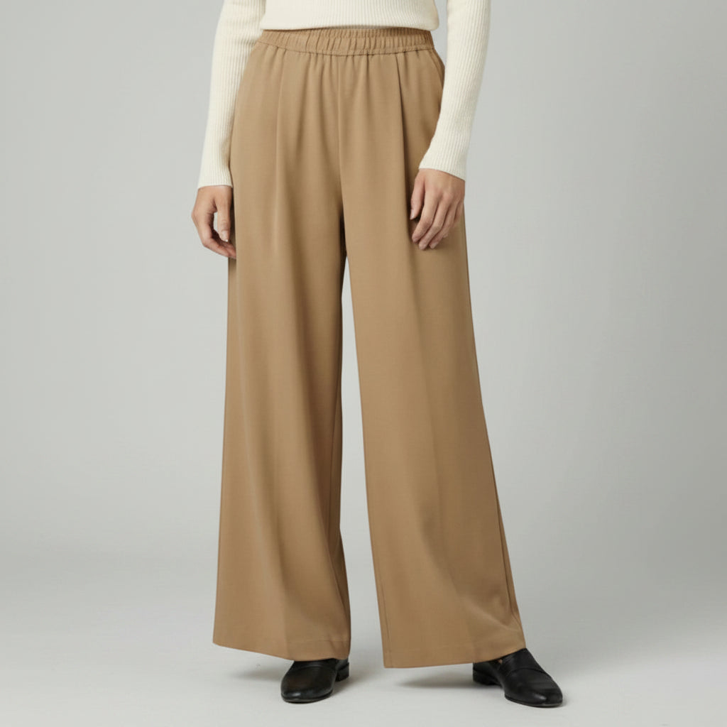Silvorne women's camel wide-leg trousers with elastic waistband and pleated detail, full length.