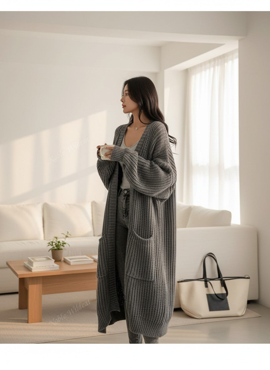 Silvorne cárdigan largo de punto gris con mangas largas y bolsillos, ideal para otoño e invierno.