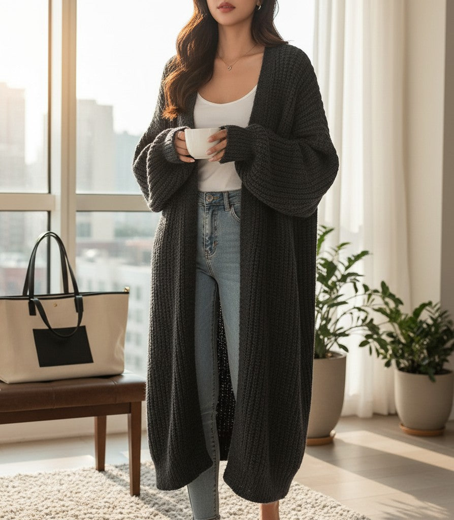Silvorne cárdigan largo de punto negro de manga larga con bolsillos, ideal para otoño e invierno.