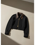 Silvorne cárdigan corto de punto grueso negro con cuello de cuero y cremallera frontal, ideal para otoño.
