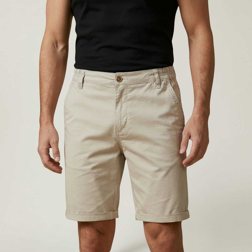 Silvorne men's relaxed fit chino shorts in beige cotton with elastic waist detail and cuffed hems.