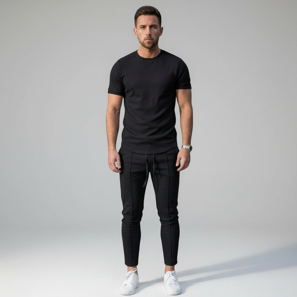 Silvorne men's black relaxed-fit 2-piece set with matching top and bottoms, simple design, casual wear.