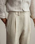 Silvorne men's light beige high-waist pleated trousers in woven fabric with a classic waistband and button closure.