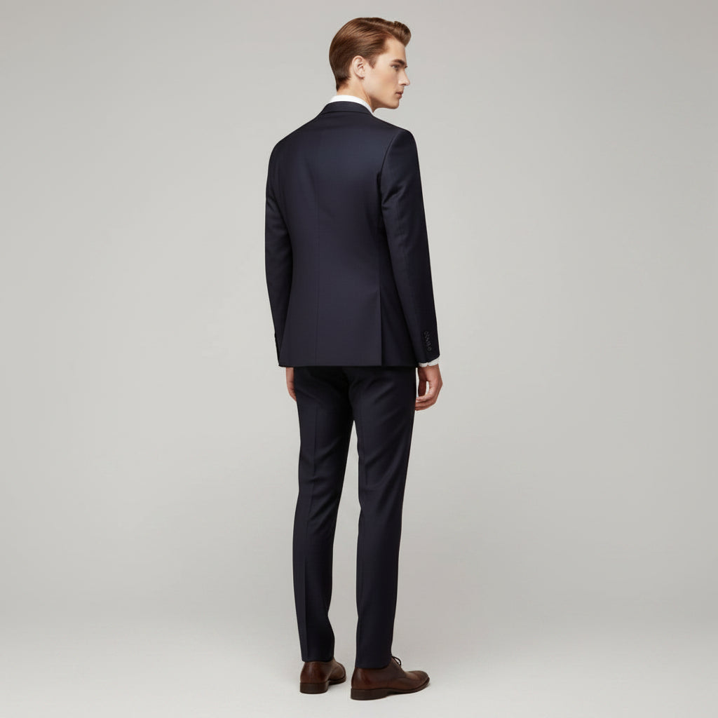 Silvorne men's navy blue 3-piece suit with notch lapel blazer and straight-leg trousers. Model from behind.