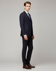 Silvorne men's navy blue 3-piece suit with notch lapel blazer, waistcoat, and trousers. Model wears white shirt and striped tie.