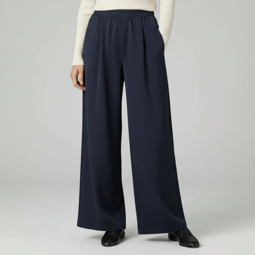 Silvorne navy blue wide-leg trousers with elastic waistband and pleated detail, casual wear.