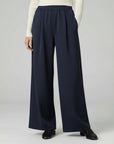 Silvorne navy blue wide-leg trousers with elastic waistband and pleated detail, casual wear.