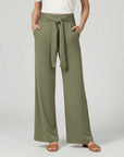 Silvorne women's olive green wide-leg trousers with a tied waistband and pockets.