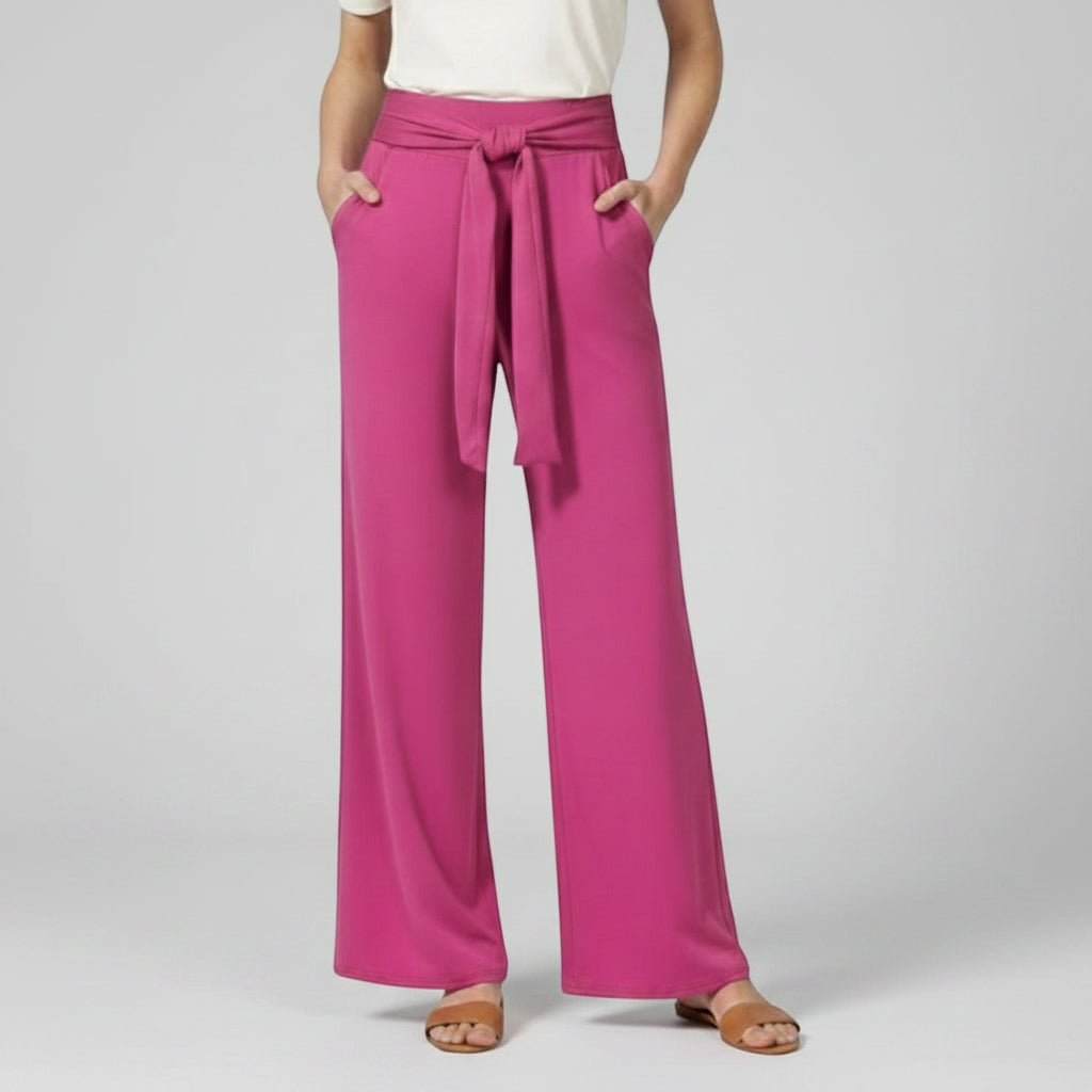 Silvorne women's bright pink wide-leg trousers with a tied waistband and pockets.