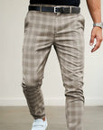 Silvorne men's slim-fit ankle-length plaid pants in beige and brown woven fabric.