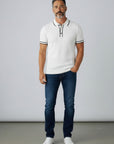Silvorne polo de manga corta blanco con ribete negro, tejido acanalado, cuello y puños a rayas. Ideal para verano.