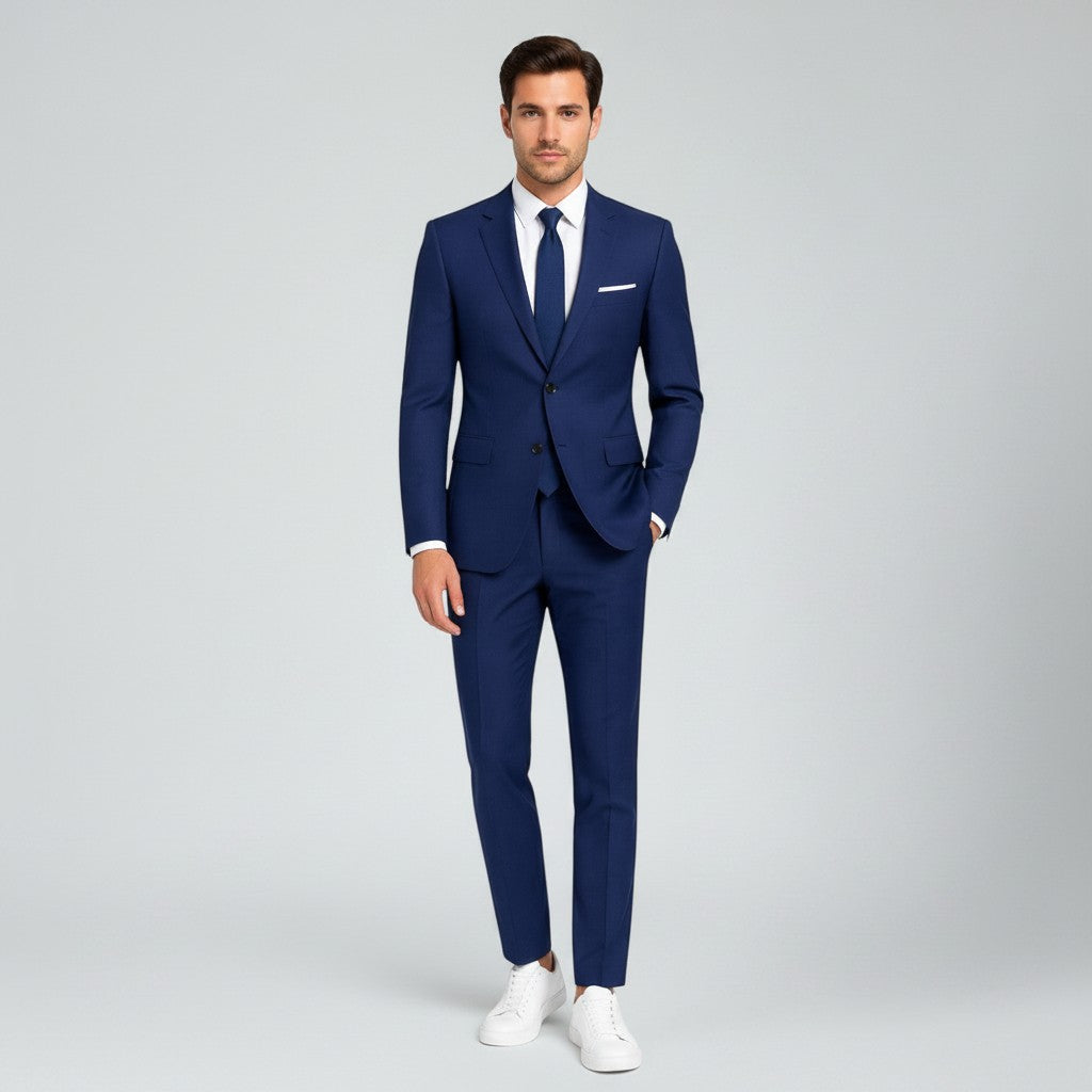 Silvorne men's slim fit royal blue linen suit with white shirt and navy tie. Model wears suit for formal events.