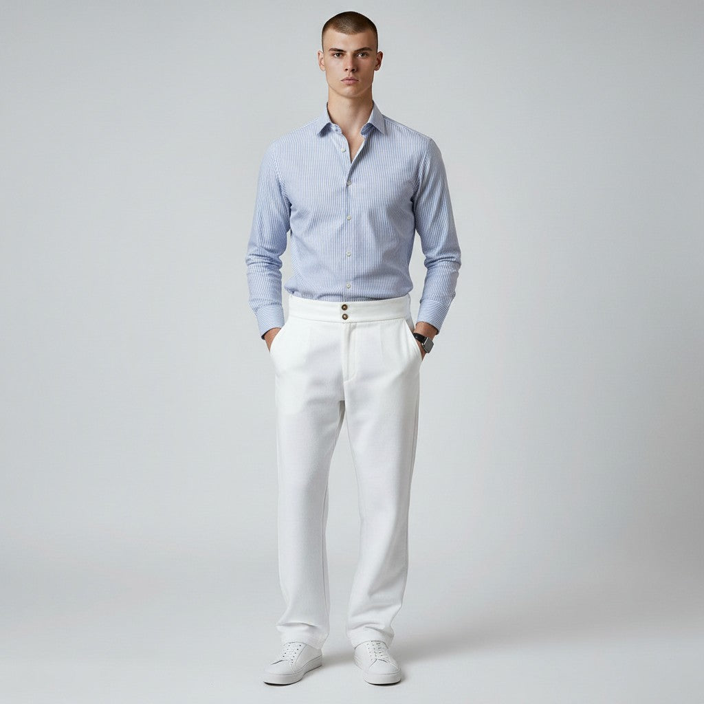 Silvorne men's white high-waist straight-leg trousers with double button closure and front pleats. Model wears with a blue striped shirt.