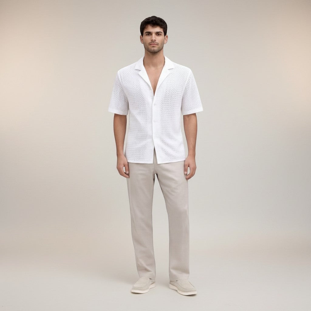 Silvorne men's white short sleeve button-up shirt with open-knit texture and camp collar, paired with light beige trousers.