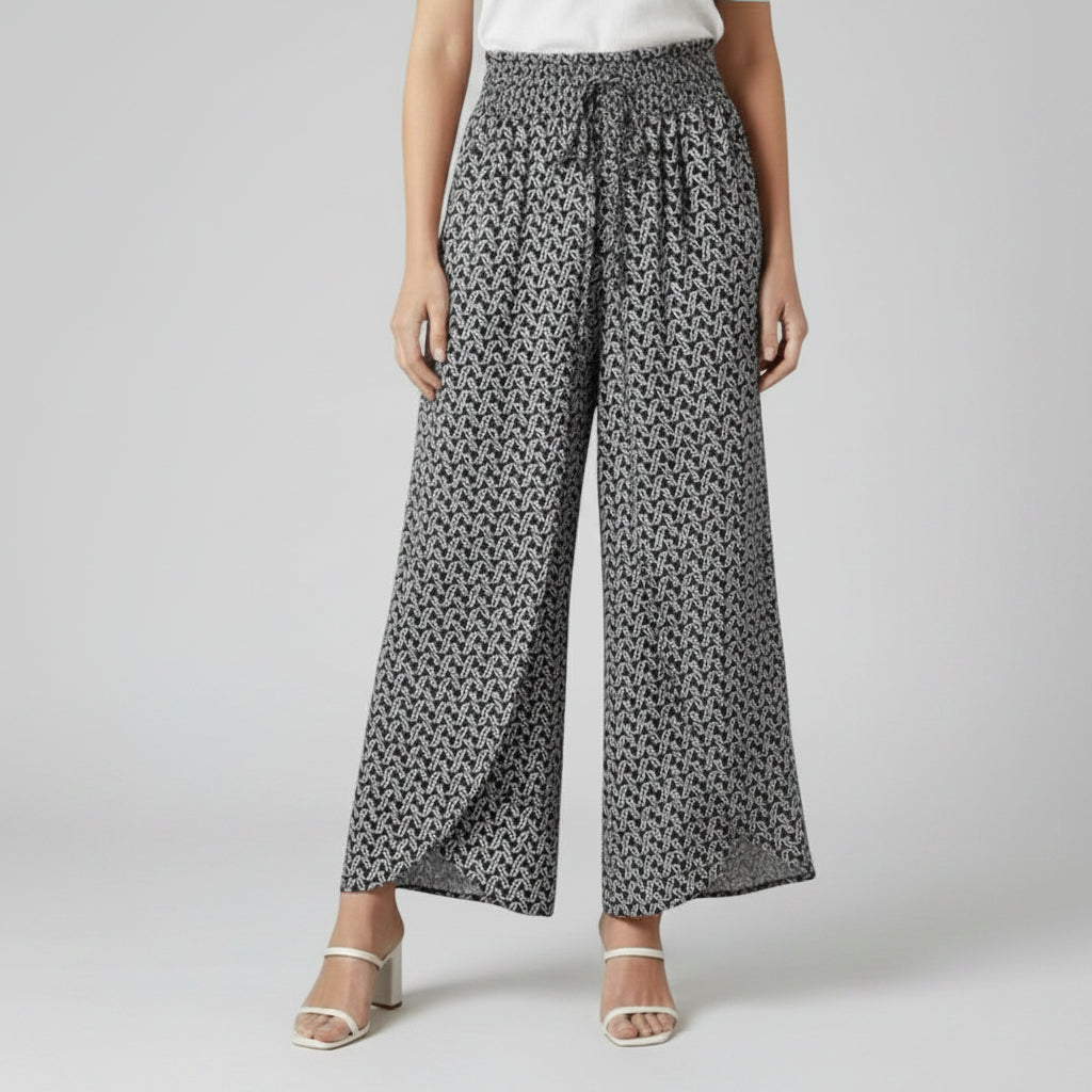 Silvorne women's black and white patterned wide-leg trousers with elastic waistband and drawstring.