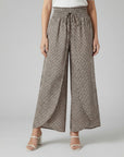 Silvorne women's wide-leg trousers in beige with a dark grey geometric pattern, elasticated waistband, and drawstring.